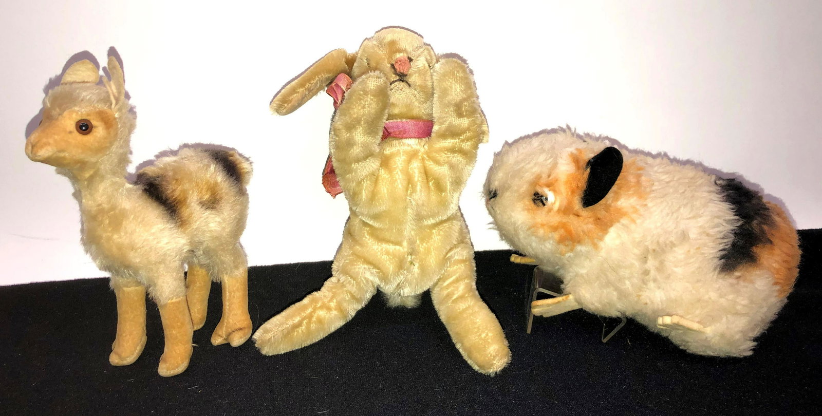 STEIFF ANIMALS (3): (1) sleeping floppy bunny; ear button; (1) llama; damaged ear; (1) guinea pig; H-3"-6"; G