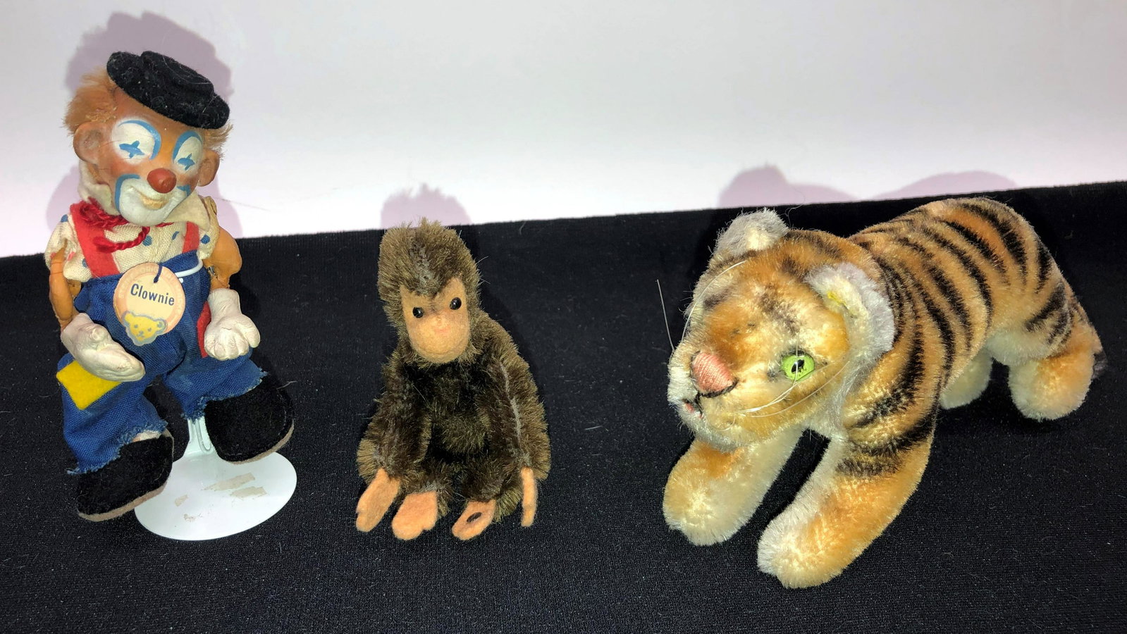 STEIFF ANIMALS (2) AND CLOWN (1): Tiger and monkey with button; clown has damage to arms; H-3"-4"; normal wear; G-VG
