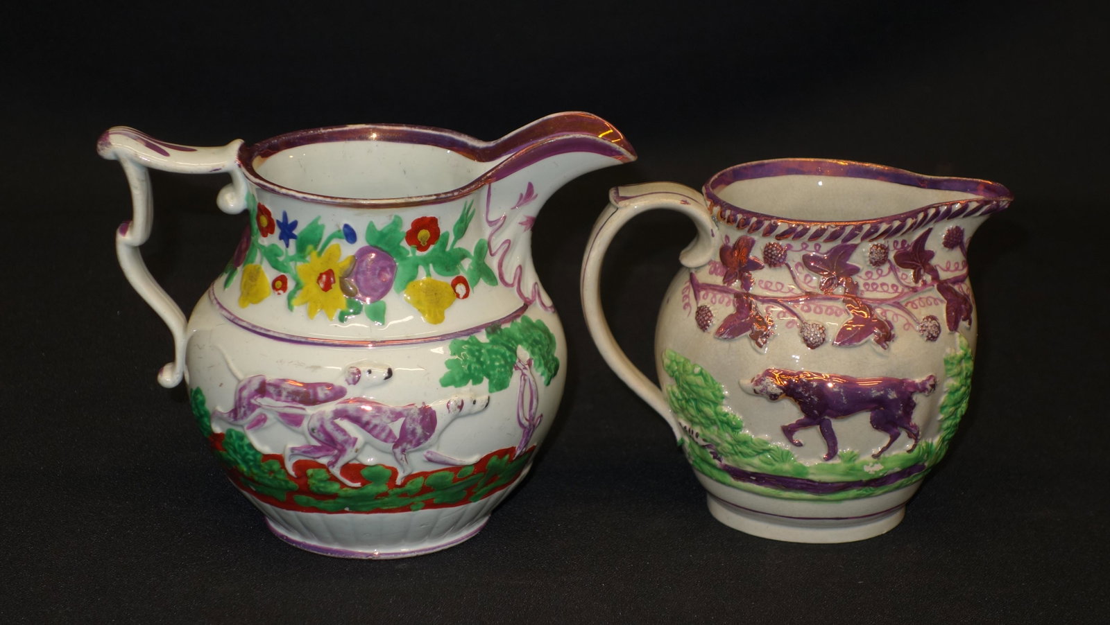 LUSTRE WARE (2): Pink lustre. Relief decorated dogs, flowers, fruit. Normal wear. Crazing. H5"-5.5" G