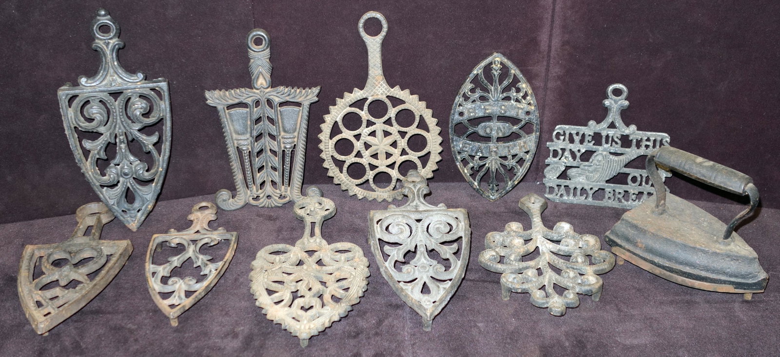 METAL IRON AND TRIVETS (10+): Mostly cast iron; some rust; paint chips; (1) trivet has small crack; longest- 10"; G-VG