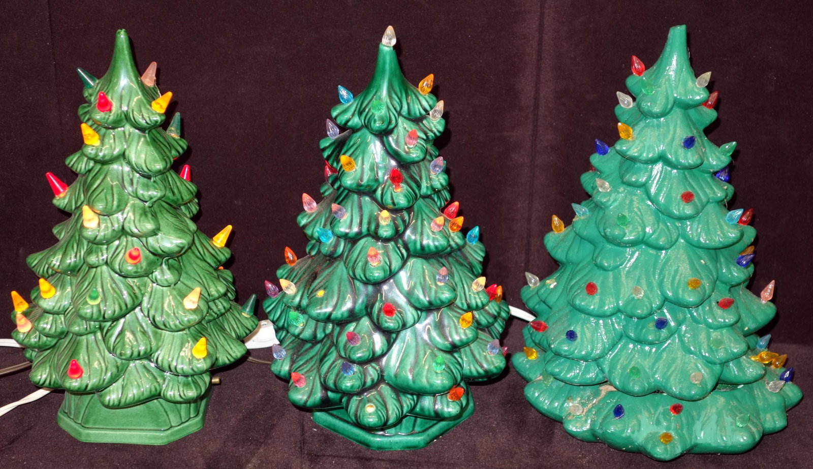 CERAMIC CHRISTMAS TREES WITH PLASTIC LIGHTS (3): (1) Christmas tree is a (1) piece and has all lights; (2) Christmas trees are in (2) pieces- base and top; bases have minor chips; tallest- 12"; G-VG