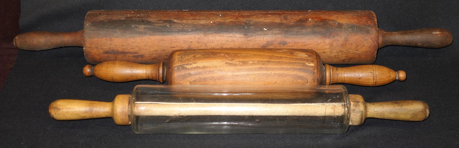 ROLLING PINS (3): Wood and glass; chips in wood; wood loss; loose handles; cracks present; normal wear; surface irregularities; longest L-27 1/2", G-VG