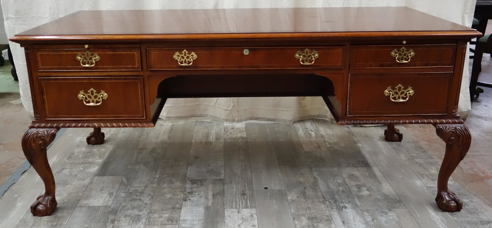CHIPPENDALE PARTNER'S DESK: Mahogany; locking drawer with key; 1" finish loss on top; minor scuffs; together with leather office chair (not pictured); L-72", G-VG