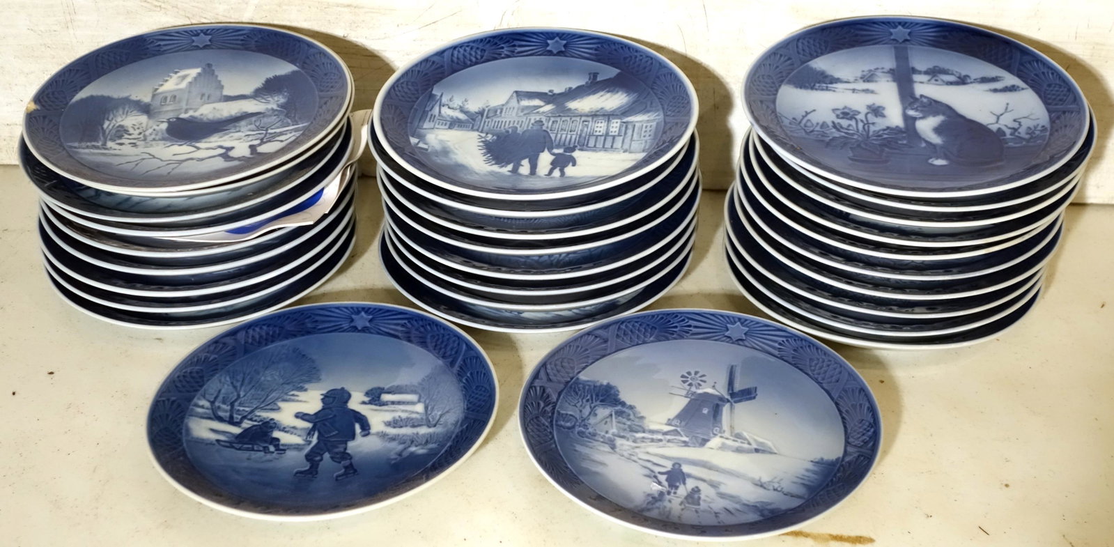 ROYAL COPENHAGEN PLATES (29+/-): 1963 - 1997; chip in front of 1966 plate; normal wear; Dia.-7 1/4", VG-EX