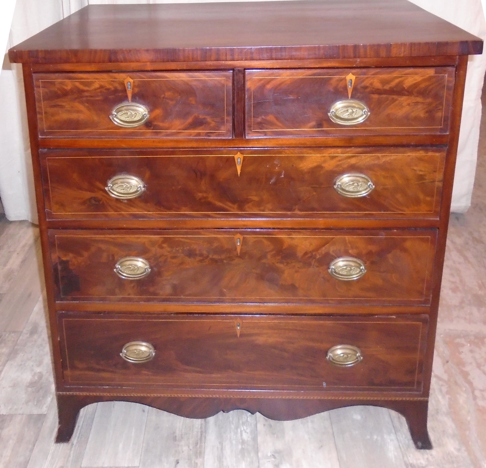 HEPPLEWHITE CHEST OF DRAWERS: American Mahogany Line inlay. (5) drawer, French bracket feet. Some old repair, side checking. Normal wear. G-G+ H41" W39"