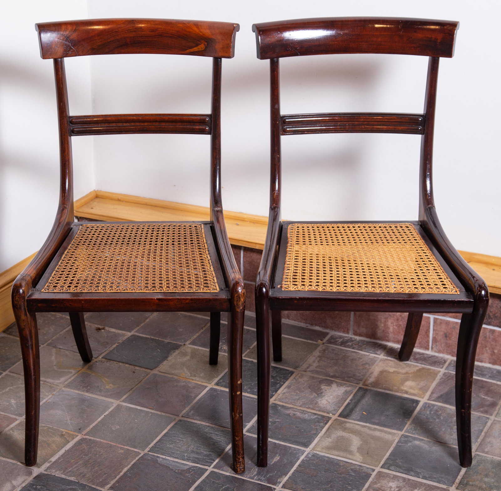 SET ANTIQUE KLISMOS CHAIRS (4): Mahogany -cane seats. Sabre leg. Grooved spacer rail. Old refinish. Finish slightly different. Normal wear. H-33" W-18". G-VG