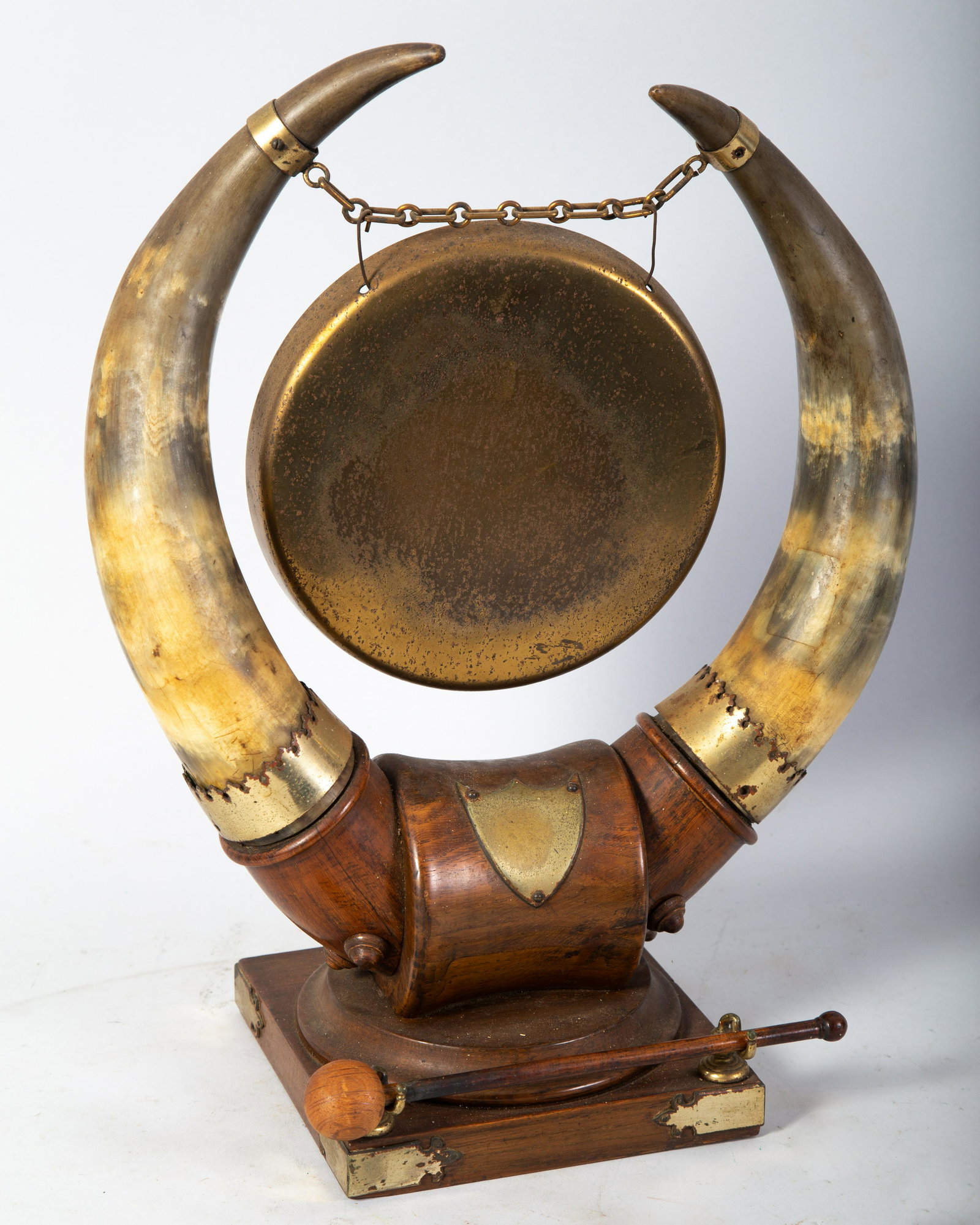 ANTIQUE DINNER GONG: Cow horn harp with brass fittings, Oak base. Lacquered brass pitted. Normal wear. H17.5" G-VG