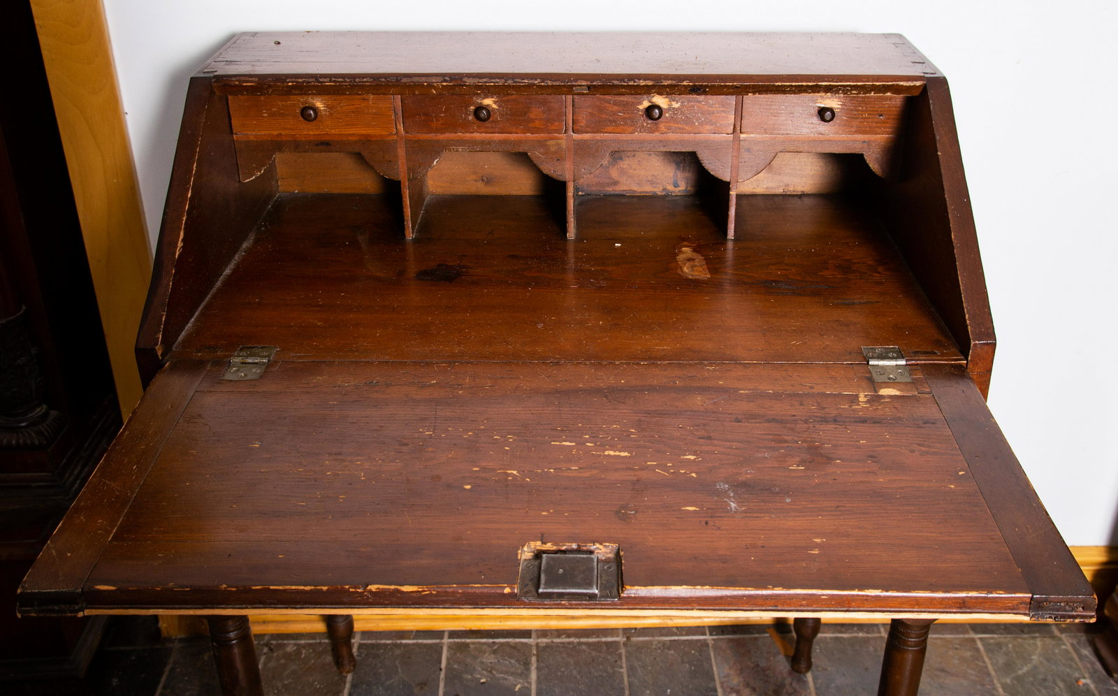 PENNSYLVANIA DESK ON STAND: (2) Piece. Pine-slant front. Dovetailed top-simple well. Turned legs-single drawer. H43 W34. Wear-some losses. F-G
