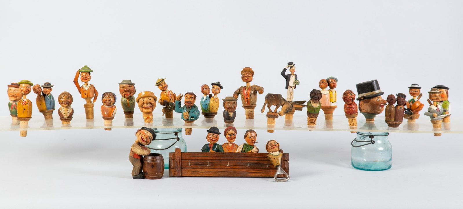 BOTTLE TOPPERS BAR ACCESSORIES (26+/-): Most animated-carved & painted wood. German, Austrian, Italian, etc. (1) musical but wound tight-many kissing, mouths opening, etc. H 3.5-7" Normal wear. G-VG