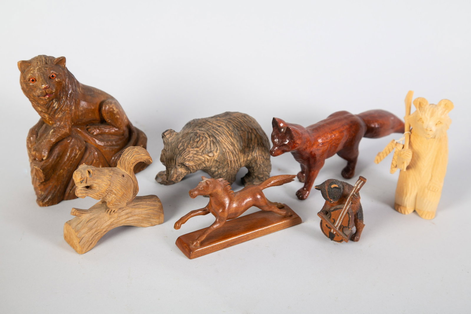 CARVED WOOD ANIMALS (8): American, German, Russian, etc. Horse American (John Cowden)-Fox looks American. H 3-6" Cat has tail loss. Normal wear. G-VG