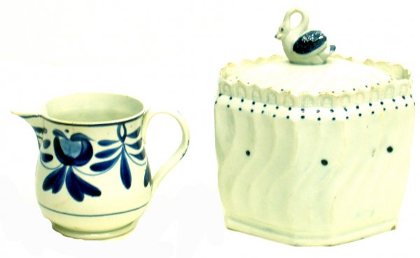 (2) PCS. ENGLISH PEARLWARE: (2) PCS. ENGLISH PEARLWARE - (1) swan finial sugar box, chip on lid and several small border and base chips; (1) brush-stroke cream pitcher, small hairline; Sugar H-6", G