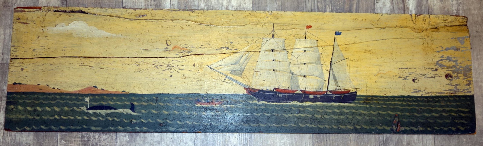 FOLK ART SAILING SHIP PAINTING: On board; some paint flaking, mostly on right end; wood splits; 12" x 44 1/2", G-VG