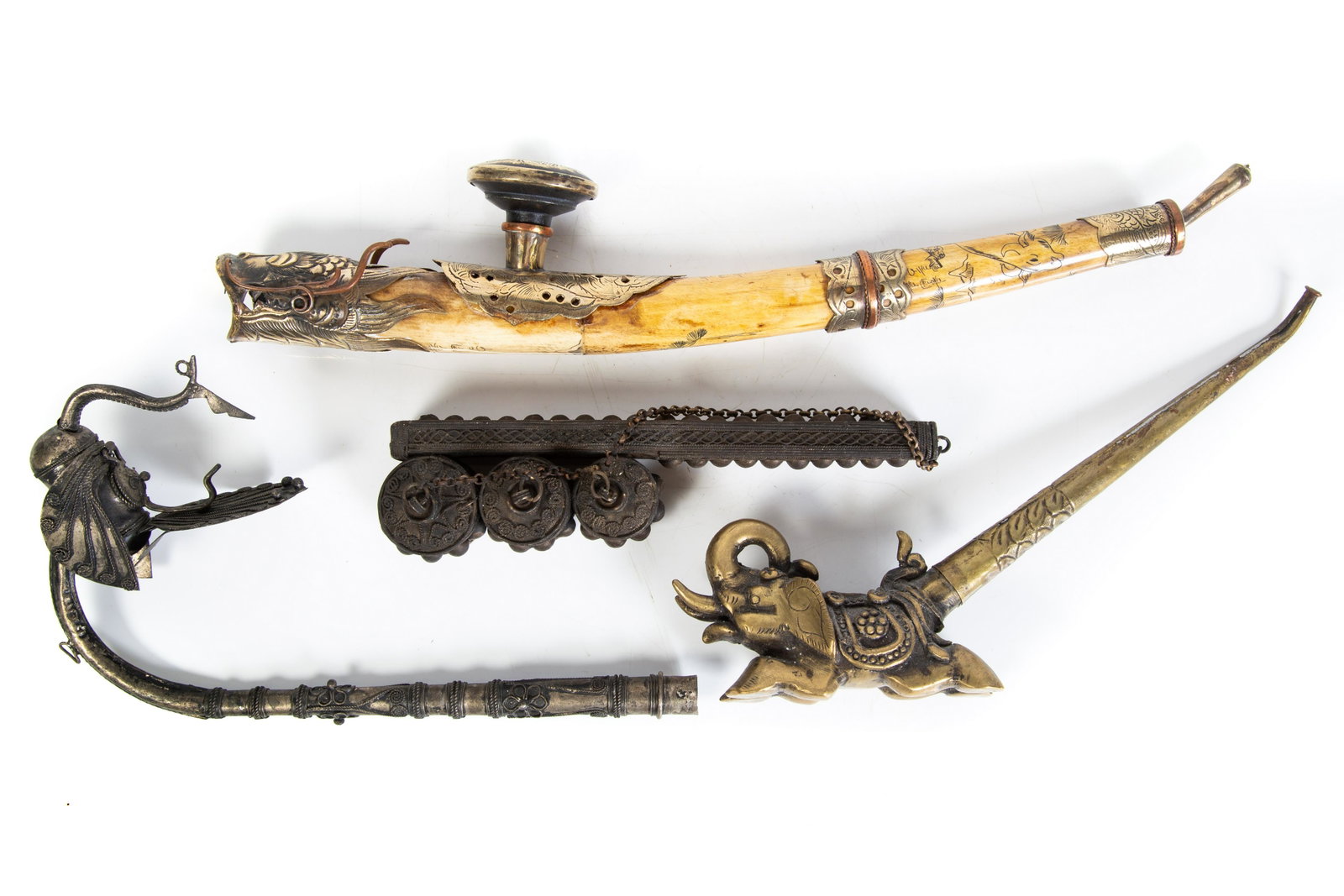 SOUTHEAST ASIAN PEN HOLDER & PIPES (4): (1) scrimshaw bone pipe; (3) metal/brass pipes and pen holder; wear; L-7"-14", G-G+