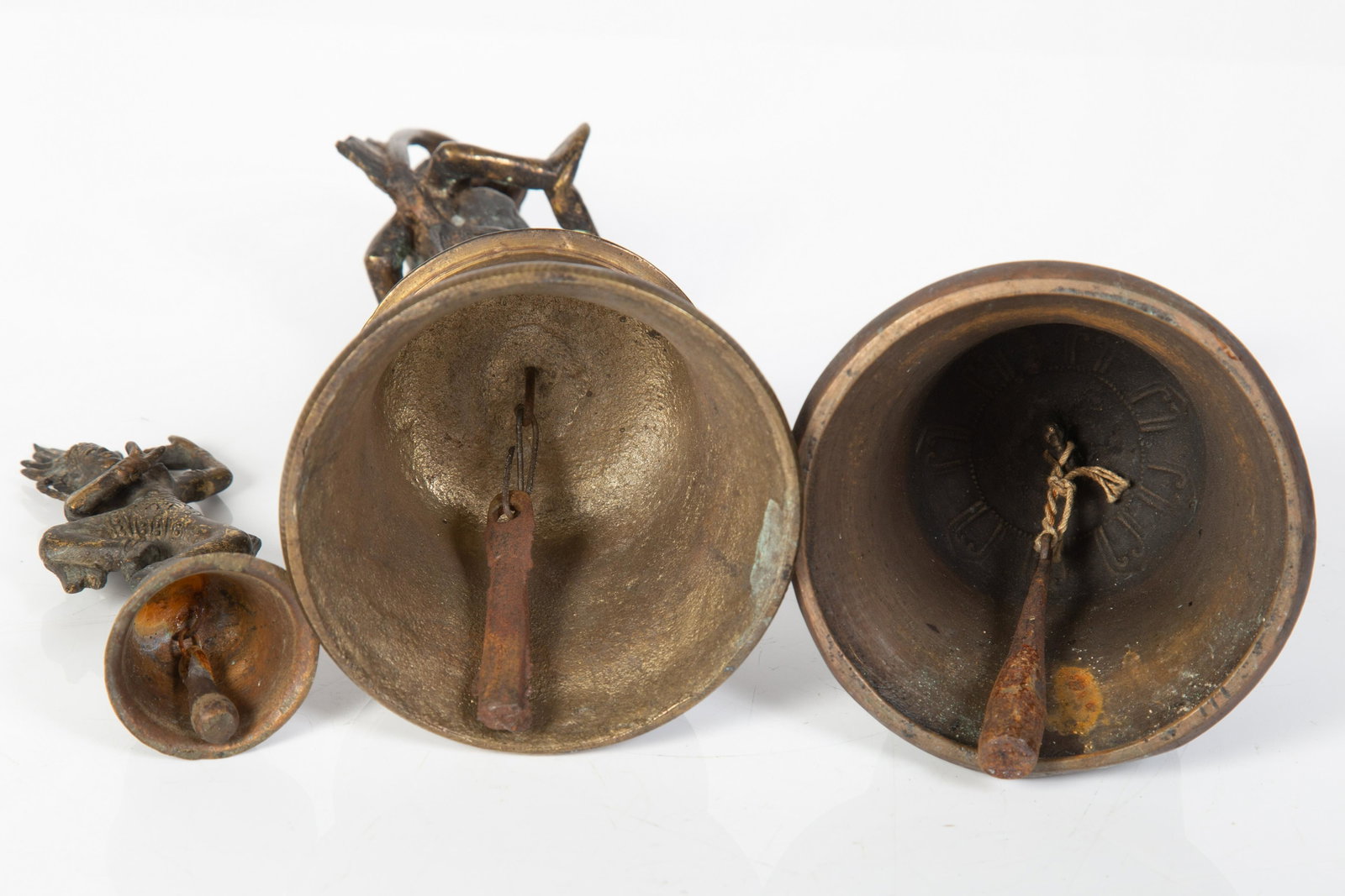 BRONZE OR BRASS BELLS (3): Tallest: monkey/devotee, Indian, 20th Century; middle: Tibetan, late 19th Century; smallest: Thai, 20th Century; (1) weathered; normal wear; tallest H-9", G-VG
