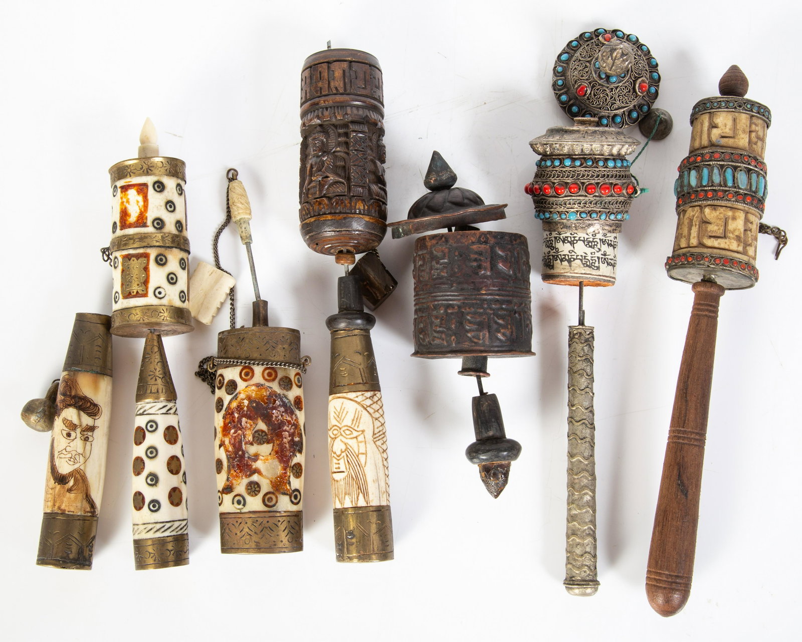 PRAYER WHEELS (11): Includes: (5) Nepalese and Tibetan Buddhist prayer wheels, early to mid 20th Century; (6) Himalayan region Buddhist prayer wheels, 20th Century, wood, bone and metal; some wear, damage and losses; tal
