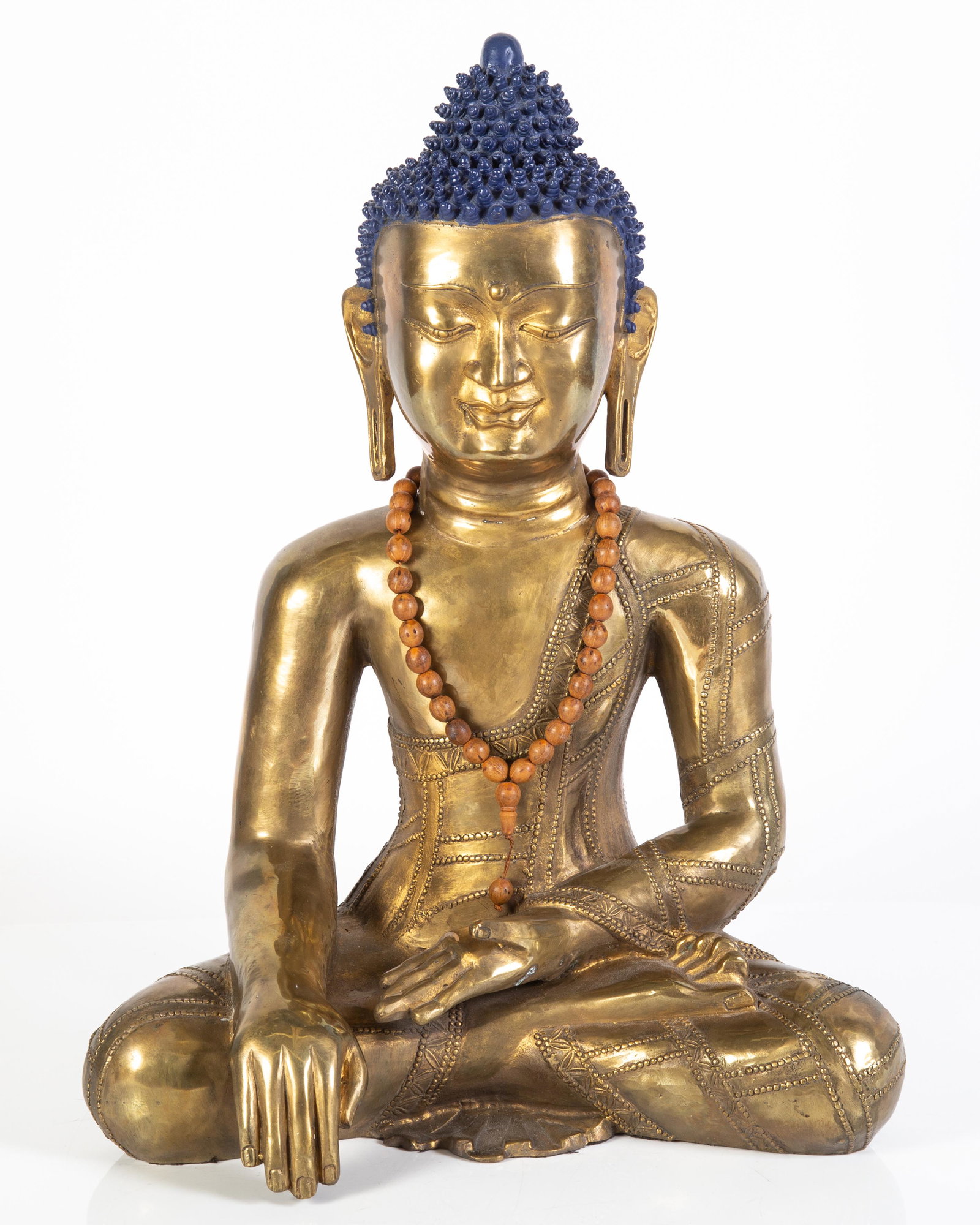 THE BUDDHA: Probably Nepal or Northern India; polished brass/bronze, polychrome hair; late 20th Century; normal wear; H-16", G-VG