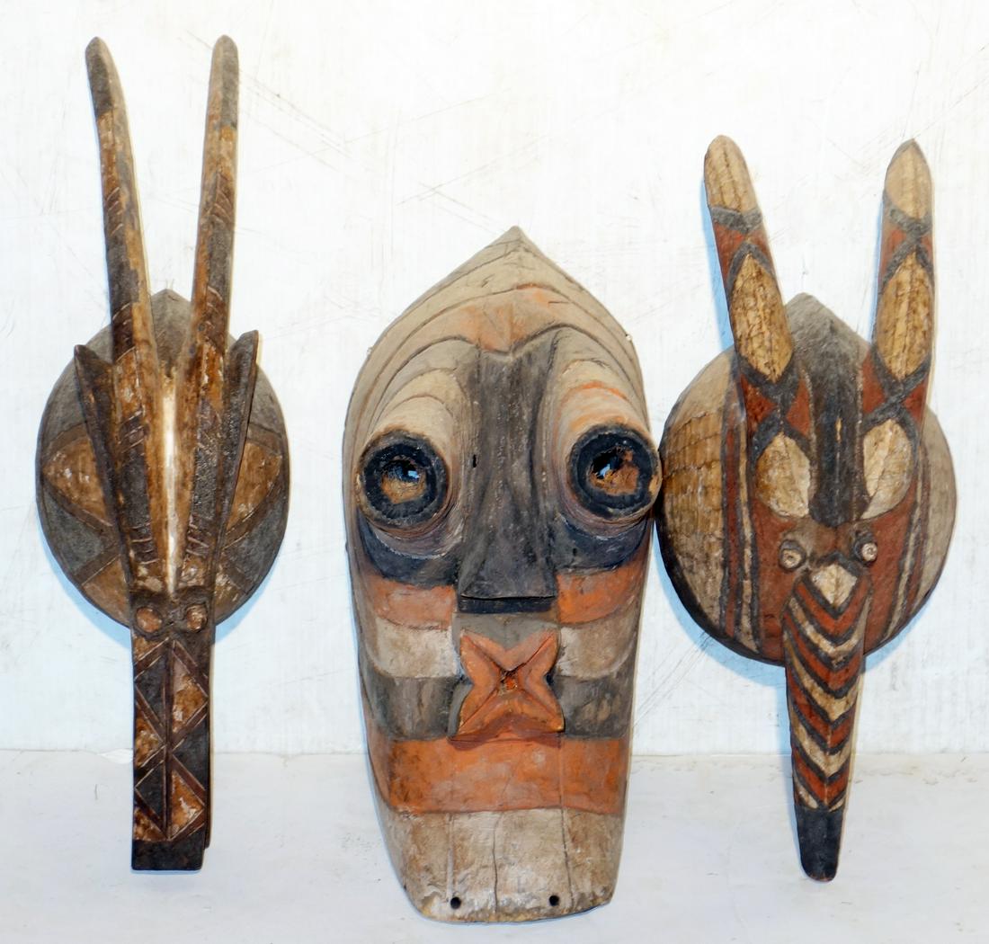 (3) AFRICAN CARVED, PAINTED MASKS: Normal wear; largest 15" x 7", G-VG
