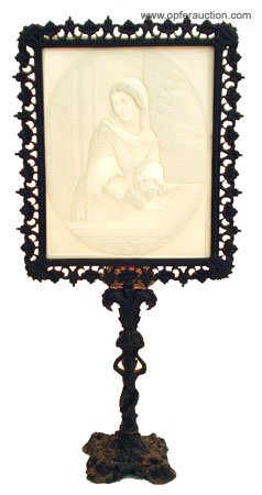 LITHOPHANE CANDLE LAMP: LITHOPHANE CANDLE LAMP - Lithophane of young woman on cast bronze candlestand; stamped on back K.P.M. 338 B; image of seated woman with folded hands, stand has figural monkey; lithophane has some mino