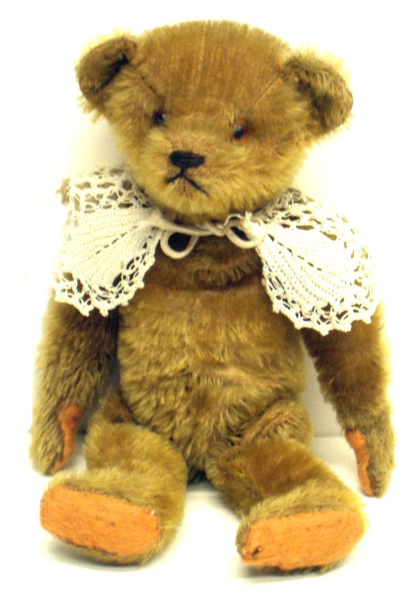 JOINTED MOHAIR BEAR: JOINTED MOHAIR BEAR - Glass eyes; lace shawl; small hump; straw stuffed; tear on right leg; some wear; H-11", G