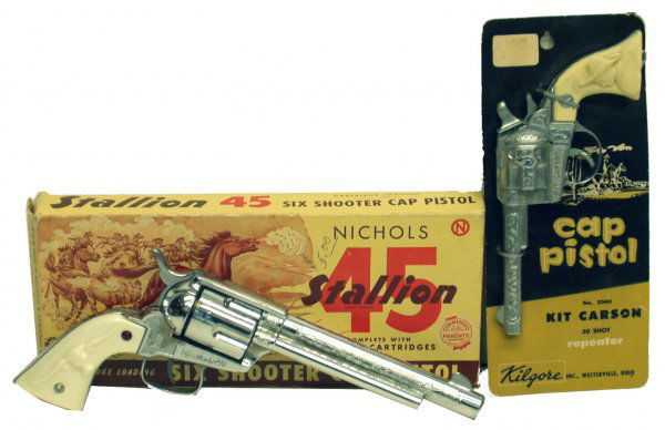 (2) CAP GUNS: (2) CAP GUNS - Cast metal with plastic handles, (1) Kilgore Kit Carson #2040 on original cardboard; (1) Nichols Stallion 45, original box with some damage and crasing, box VG; L-8"-12", EX