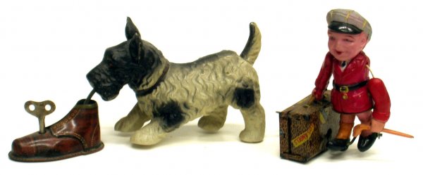 (2) JAPAN CELLULOID TOYS: (2) JAPAN CELLULOID TOYS - Both mechanical; working; (1) busy tourist, (1) dog with shoe; normal wear; L-7", G-VG