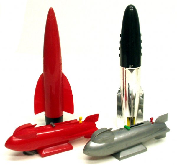 (4) TOY SPACE SHIPS: (4) TOY SPACE SHIPS - Plastic; (2) Sky Cadet banks; (2) pencil cases and contents; (1) Hasbro USA, (1) SP 56o-USA; Red pencil case is splitting at seam of fin; L-8"-10", G-VG