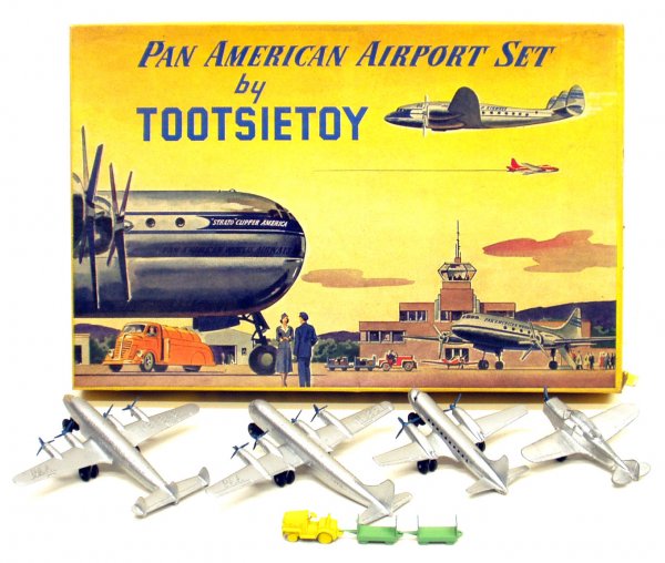 TOOTSIE TOY PARTIAL AIRPLANE SET: TOOTSIE TOY PARTIAL AIRPLANE SET - "Pan American Airport Set"; box is G-VG; contents include (4) Tootsietoy planes, (2) with PAA on wings, (2) without initialls and luggage carrier; Box L-15", G-VG