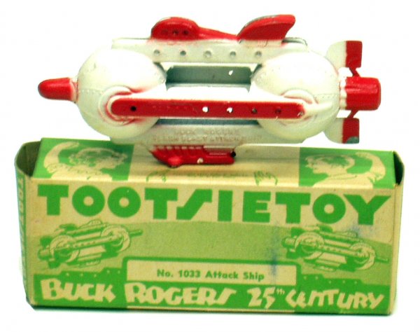 TOOTSIETOY BUCK ROGERS ROCKETSHIP: TOOTSIETOY BUCK ROGERS ROCKETSHIP - Flash Blast Attack Ship, No. 1033; painted diecast metal; USA Copyright 1937; original box cardboard litho; flaking paint; original box has minor marks and stains; 