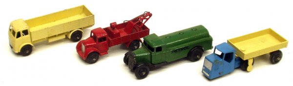 (4) DINKY TRUCKS: (4) DINKY TRUCKS - painted pot metal; tow truck, gas truck, flat bed, etc.; some wear and chips; L-4", G-VG