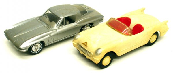 (2) CORVETTE PROMO CARS: (2) CORVETTE PROMO CARS - Painted plastic, white 'Vette has metal undercarriage and is friction; slight rust on undercarriage; L-6 3/4", G-VG