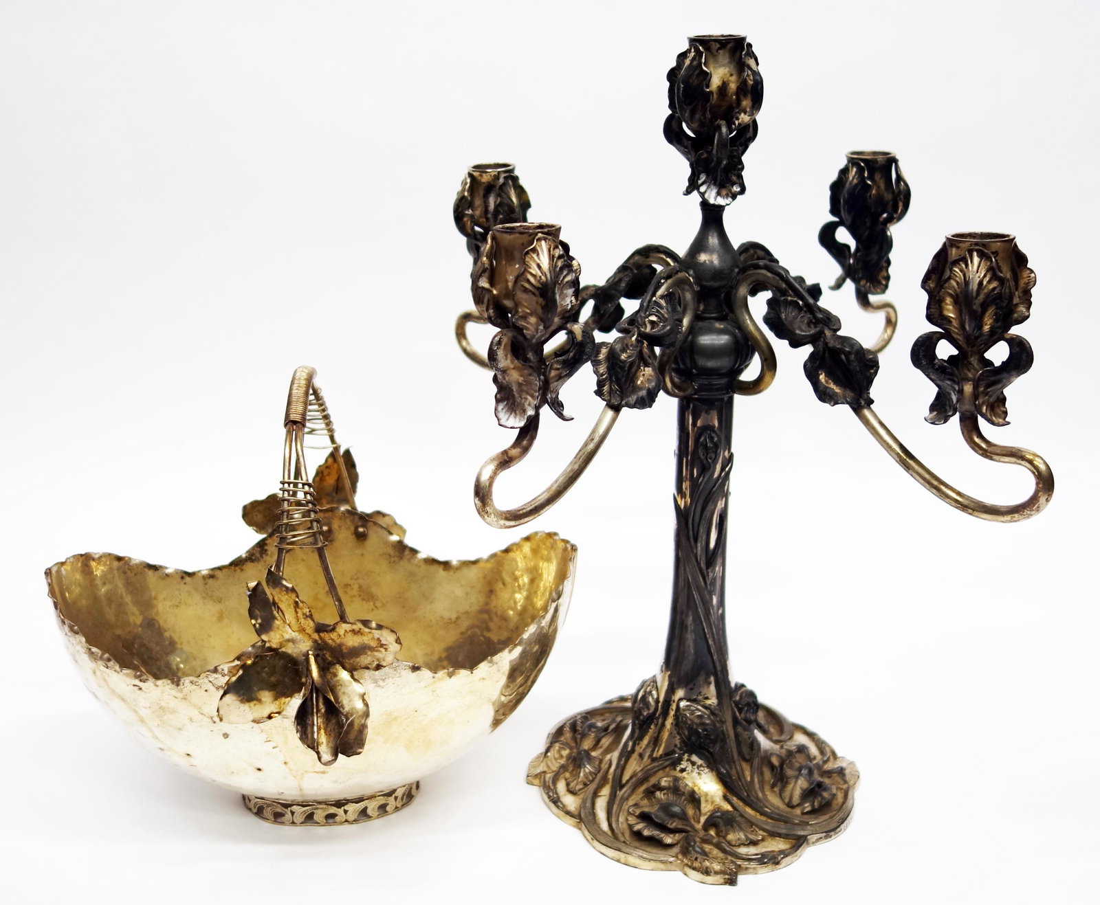 PLATED CANDLEABRA AND BASKET (2): (1) Art Nouveau candleabra; plated (5) arm; Rogers Bros; foliate design; H- 17"; (1) plated basket; applied flowers; H- 10 1/2"; G