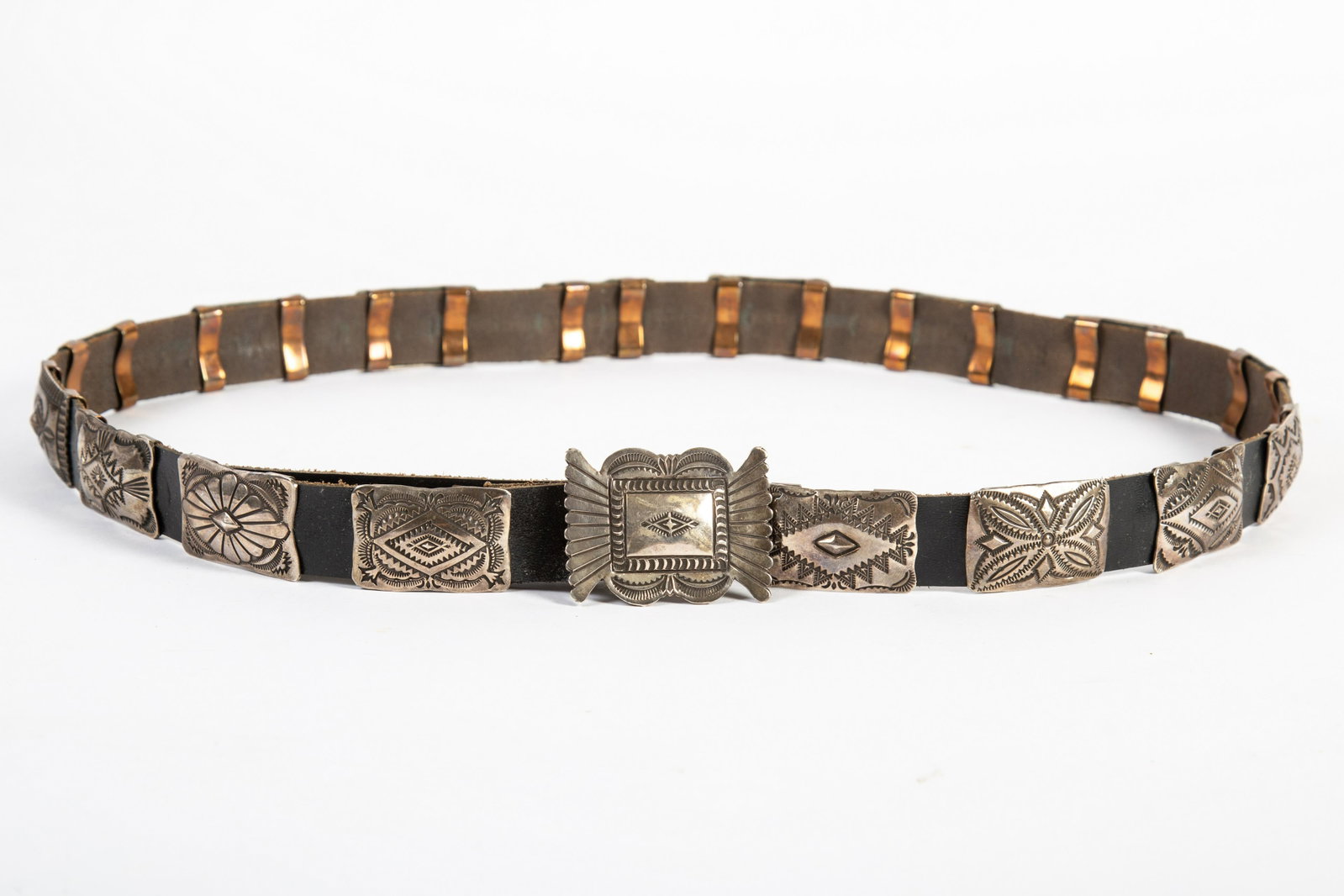 STERLING V.J.P. CONCHO BELT: Marked V.J.P.; Vincent Joe Platero; (1) buckle and (16) ; replaced leather; buckle- 1 1/2" x 2"; G-vG