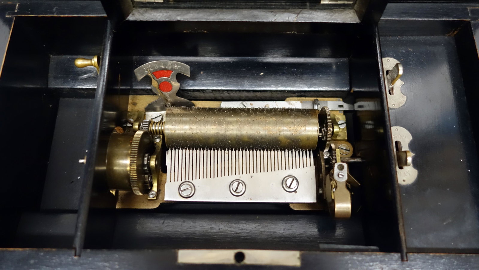 CYLINDER MUSIC BOX: (6) airs; 4 1/2" cylinder; single comb; grain painted wood case; teeth intact; plays; some inlay loss; normal wear; L- 13 1/2" (box); G-G+