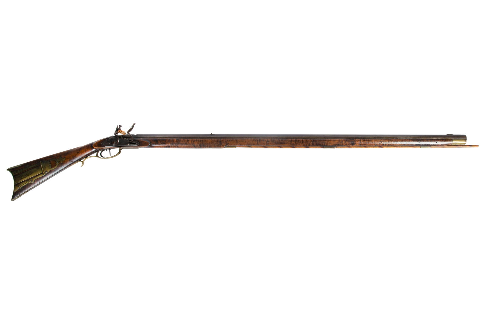 H. CARLILE KENTUCKY RIFLE: Lancaster- Shippensburg; tiger maple; signed on barrel; engraved brass patch box; foliate and scroll carving on opposite side of patch box; L- 58 1/2"; G-VG
