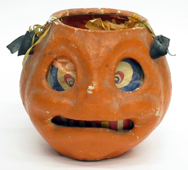 JACK O'LANTERN: Papier mache with paper eyes and teeth; painted; circa 1940's; one eye torn; missing one piece of eye; roughness; H-6", F-G