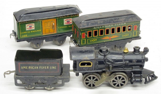 AMERICAN FLYER A.F.10 CAST IRON ENGINE with TIN CA: Cast iron wind-up engine with tin tender #120, tin passenger car #1107, tin baggage car #1108; engine has paint nicks, cars have dents, scratches and rust, F-G