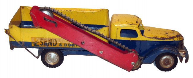 BUDDY-L SAND LOADER & DUMP: Painted pressed steel; metal gears; replaced headlights; paint loss to hood, nose and roof; scratches and rust; L-23",