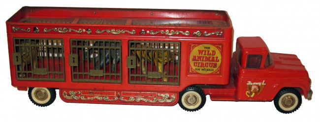 BUDDY-L WILD ANIMAL CIRCUS with ANIMALS: Painted pressed steel; plastic gates and animals; scratches and rust; L-26", F-G