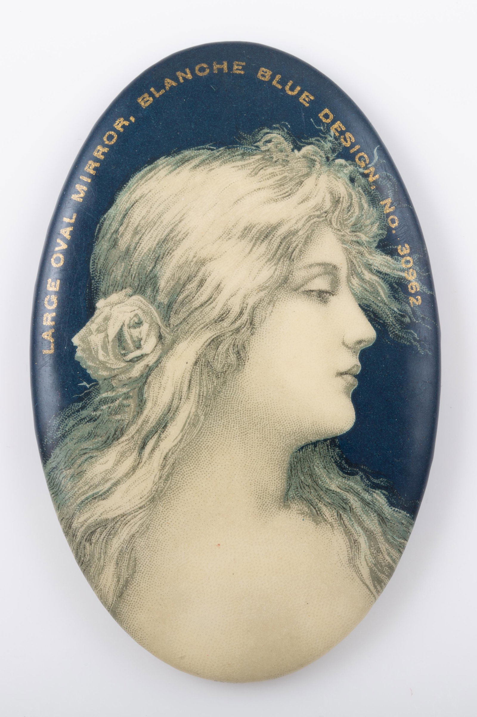 SAMPLE POCKET MIRROR: Oval, unusual sample for pocket mirrors, "large oval mirror-blanche blue, design no. 30962; mirror minor spots; normal wear; H-2 3/4", VG