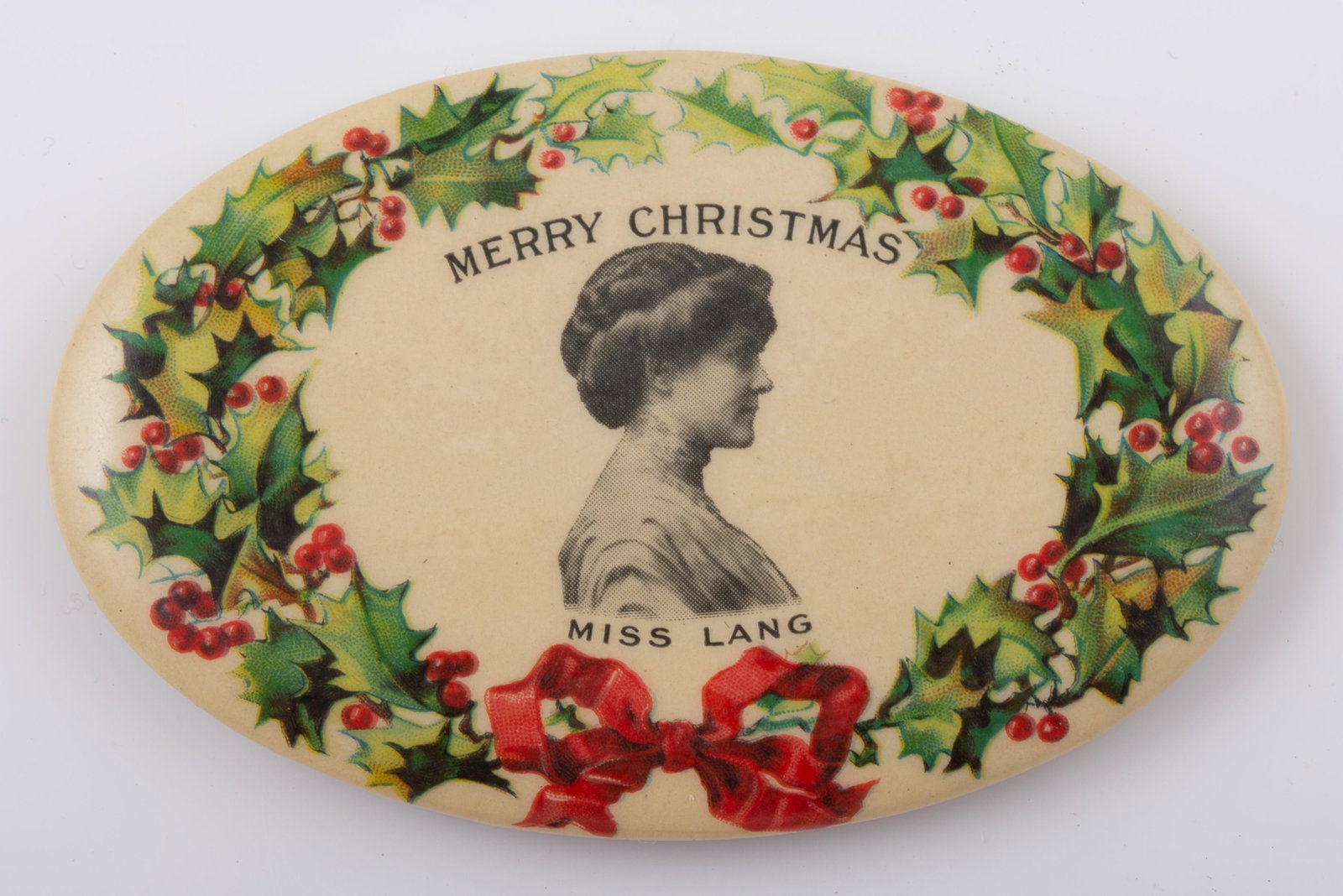 MERRY CHRISTMAS POCKET MIRROR: Oval; "Merry Christmas Miss Lang", mirror has some spots; normal wear; H-2 3/4", VG-EX