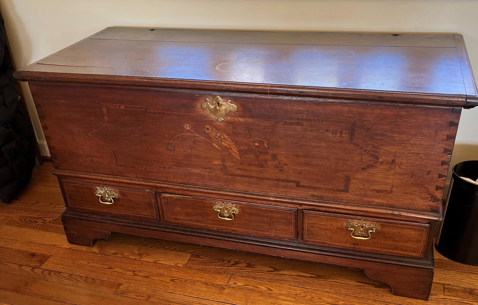 CHIPPENDALE WALNUT BLANKET CHEST: Star inlaid top; parrot inlaid front; three drawers, dovetailed; strap hinges; wrought iron handles; interior till w/ drawers; top checked; drawer edge loss; wear; H-29", W-56"; G-G+
