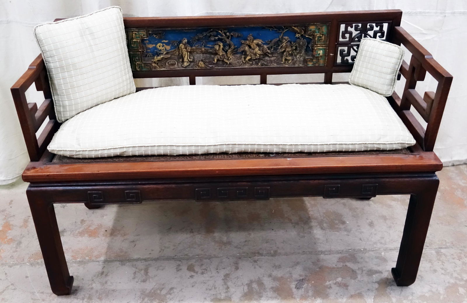 ASIAN SETTEE: Rosewood (?); carved and painted inset center panel; open work; cane type inset seat has damage; some wear and minor loss; H-30", L-45", G