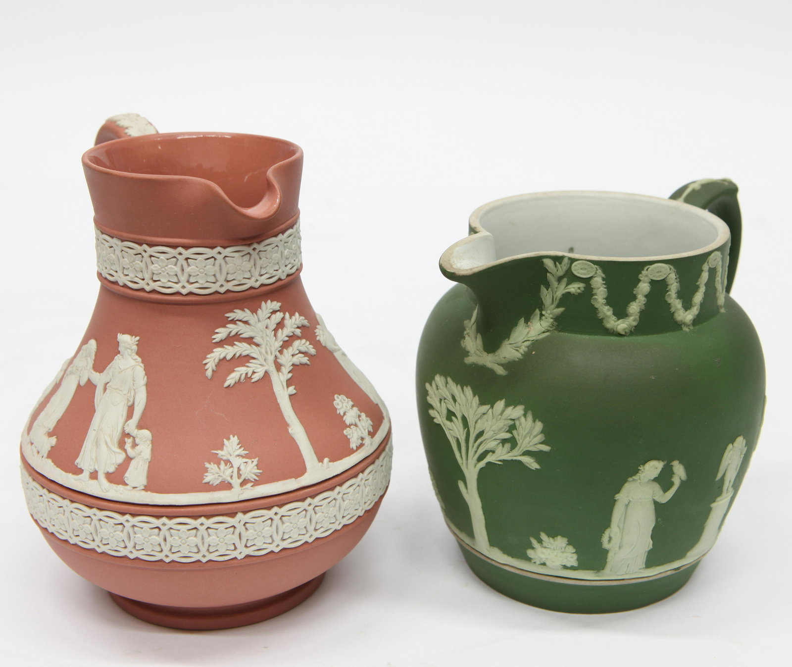 WEDGWOOD JASPERWARE PITCHERS (2) PIECES: (1) green; classical; H- 5"; (1) terra cotta; classical with cupids; H- 6"; normal wear; G-VG