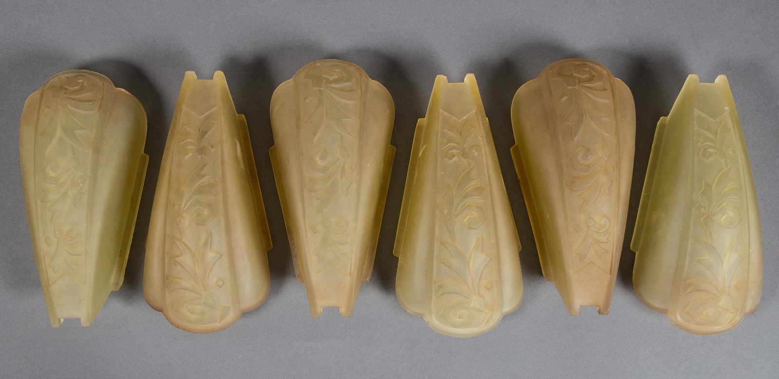 Set of 6 Art Deco Chandelier Slip Shades: Six Art Deco Slip Shades from the 1920's or 30's. Unmarked. Each shade measures 9" long and 4" wide at its widest. CONDITION: Very Good to Excellent having innumerable small chips at the fitter edge w