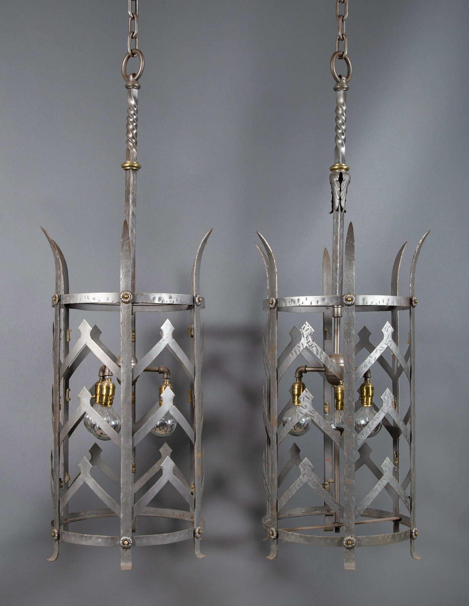 Pair Very Large Wrought Iron Hallway Lantern Pendant Lights: Pair of Medieval style wrought iron lantern pendant lights. Very large, measuring a height / length of 8' 6" from canopy to bottom of lantern. Lantern alone measures 34" high and 17" in diameter exclu