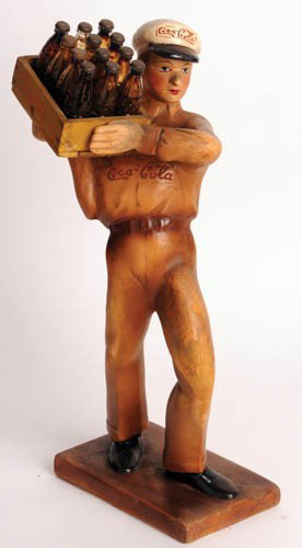 COCA-COLA DELIVERY MAN PLASTER STATUE: Coca-Cola Delivery Man plaster statue He is just fantastic, 15" tall with actual case of mini Coke on his shoulder. Coca-Cola script logo on hat as well as one on both sides of his shirt. All original