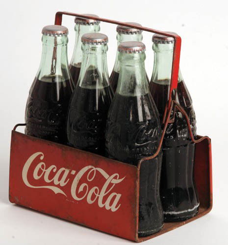 LATE 1940'S COCA-COLA TIN SIX BOTTLE CARRIER: Late 1940's tin six bottle carrier White paint specks, some edge rust and pitting on reverse. Hard to find carrier. It is filled with full period bottles