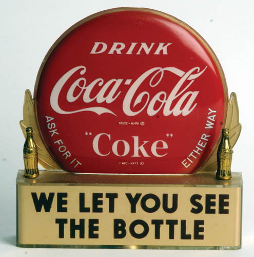 50's Coca-Cola plastic bottle display 2 Gold: 1950's plastic bottle display with two gold bottles This example is in great condition. Some surface scratches and minor wear. Hard to find complete