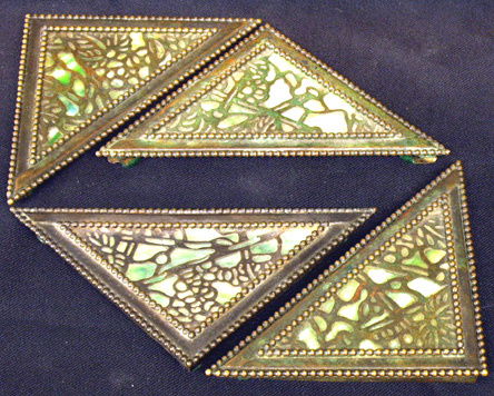RIVIERE STUDIOS Bronze and Slag Blotter Corners (4: Grapevine pattern with green slag glass; unmarked; cracks to glass; 6" (widest point)