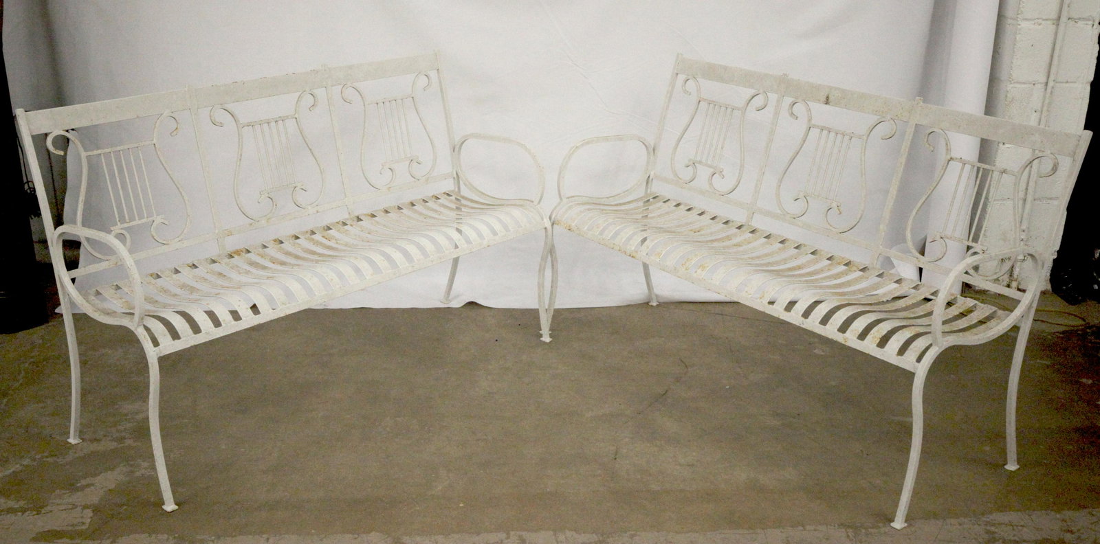 WROUGHT IRON SETTEES: Pair, lyre back, arms, weathered, H-36", L-55", G-VG
